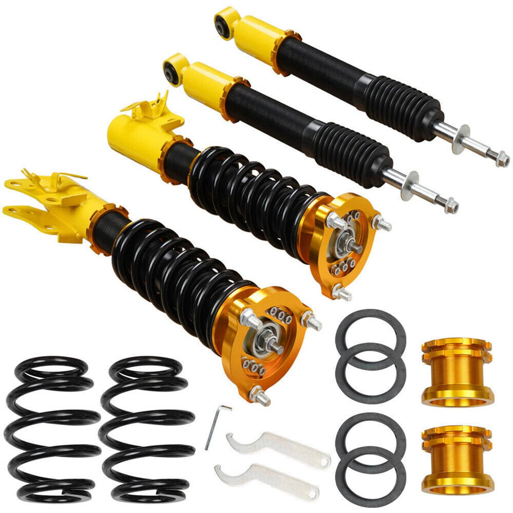 Coilover strut shocks set with black springs, gold and yellow housings, included hardware
