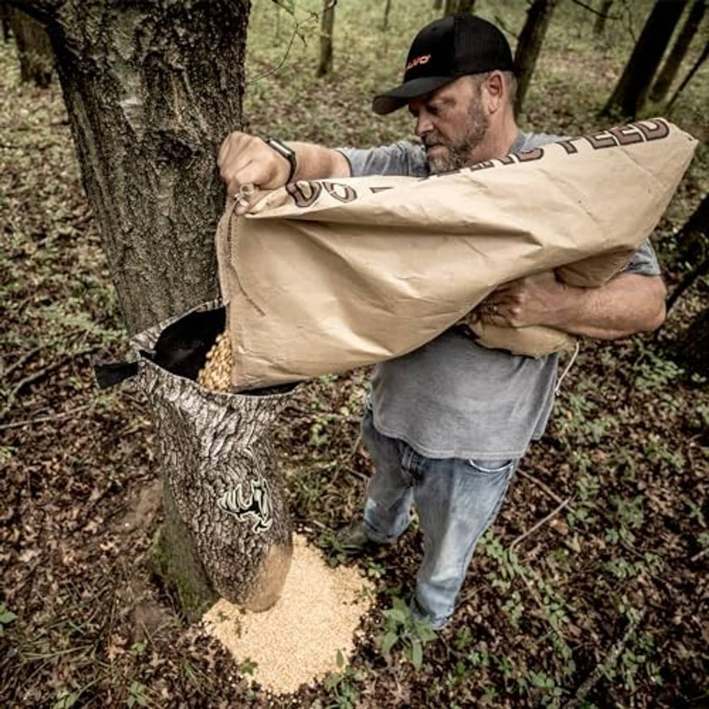 Camo gravity feeder bag opened against a tree trunk
