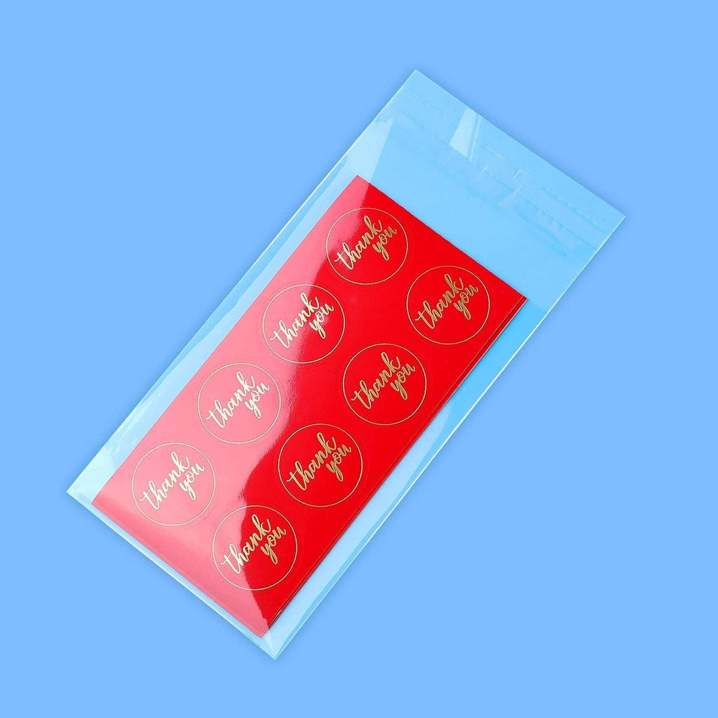 Clear self-sealing cellophane bag holding red thank-you sticker labels