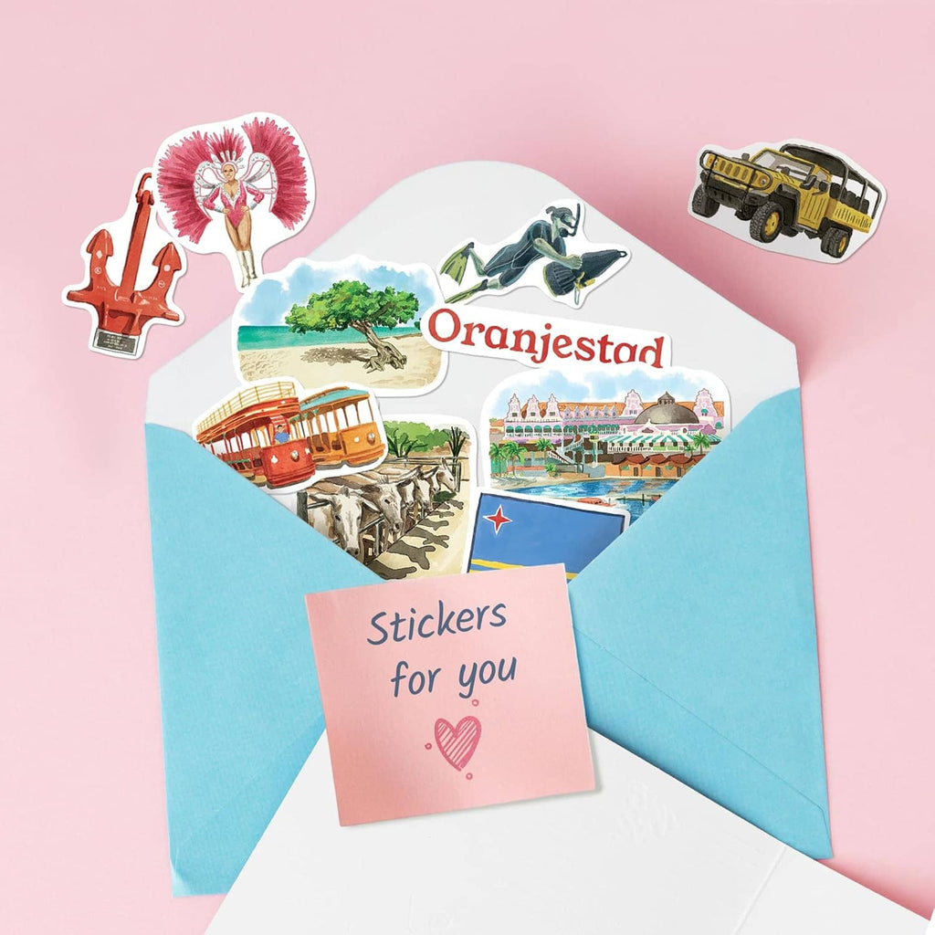 Aruba travel stickers arranged on envelopes with Oranjestad text and coral icons