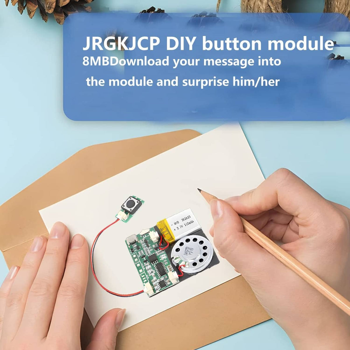 MP3 sound module PCB with speaker and push button, wiring attached on cardboard