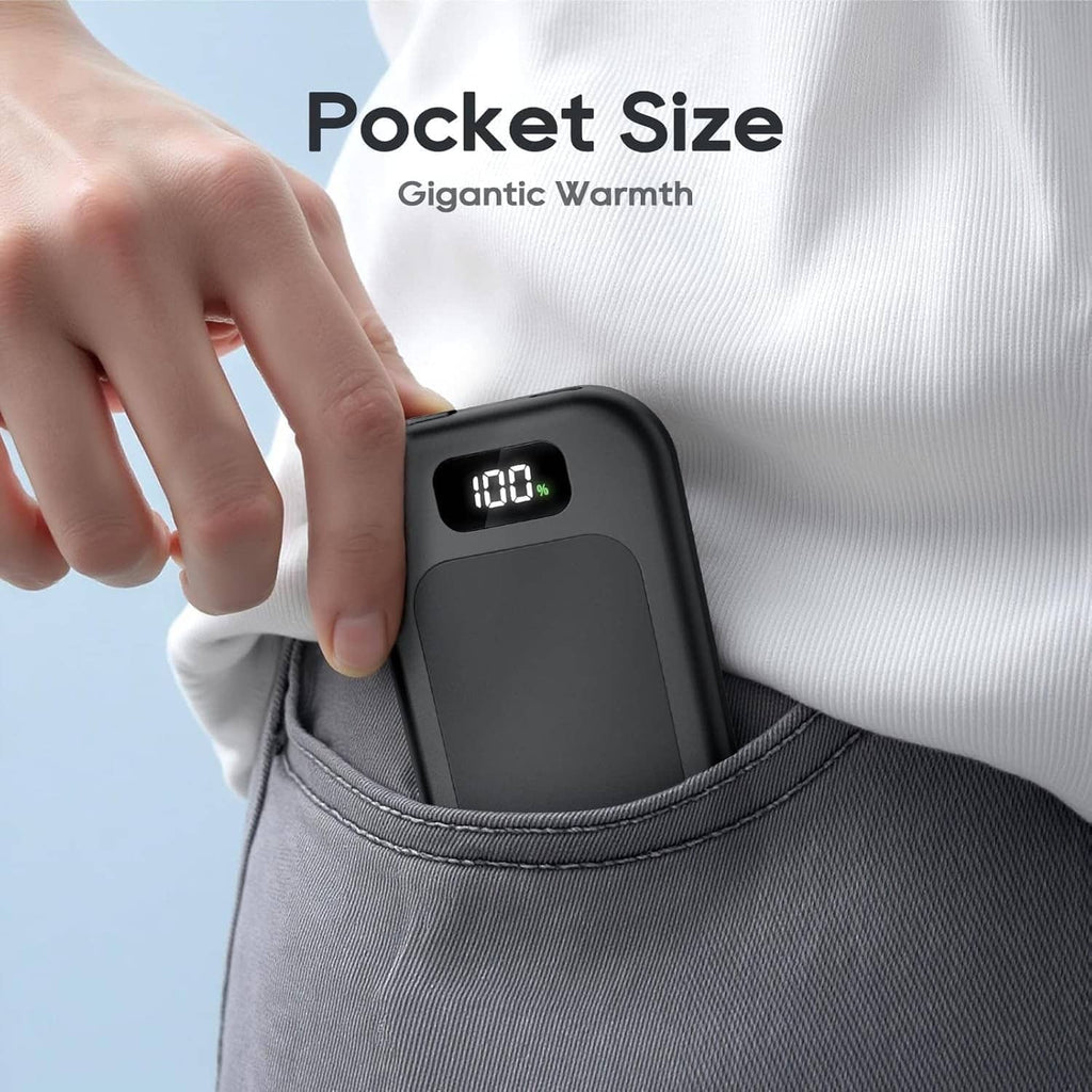 Compact black hand warmer clipped in pocket opening with digital 60°F display