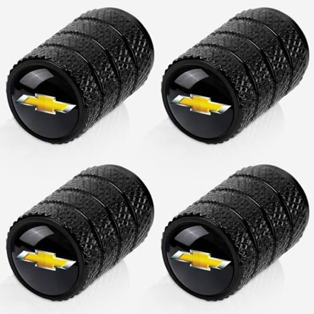 Black textured tire valve stem caps with gold Chevrolet bowtie logos, four-pack