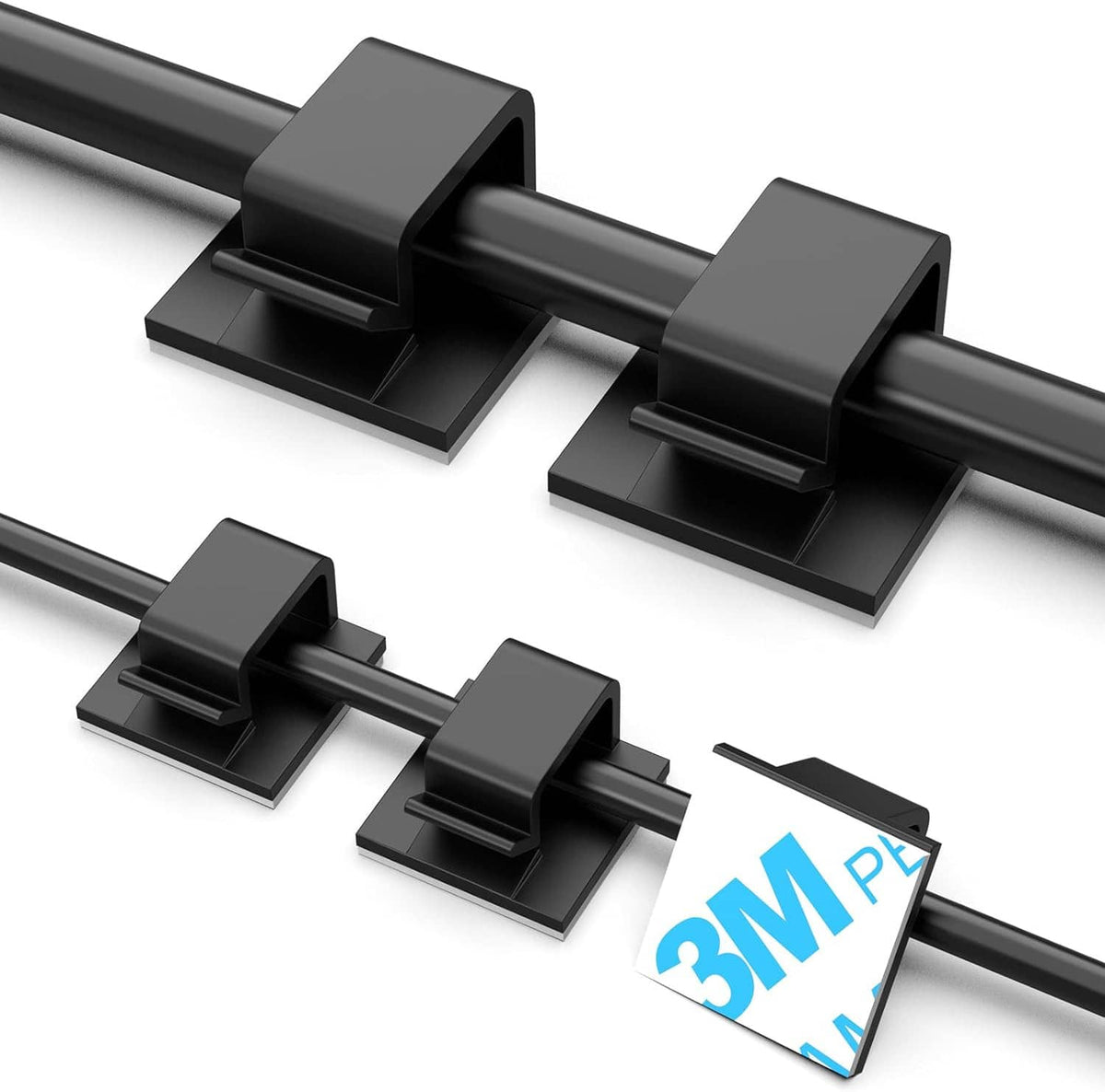 Black adhesive wire holders with raised bases, securing two dark cables