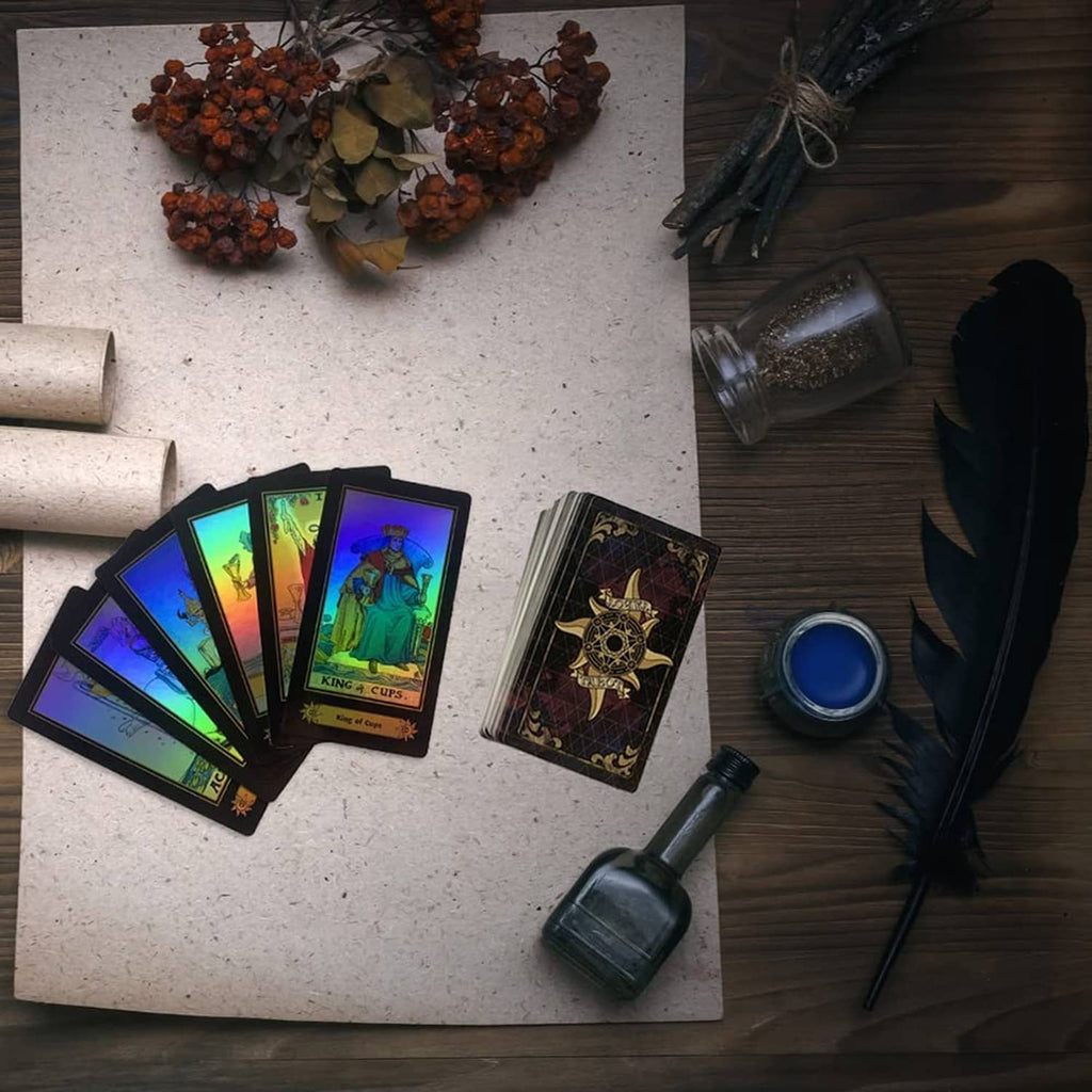 Fan of multicolor tarot cards with dark gold-ornamented back design