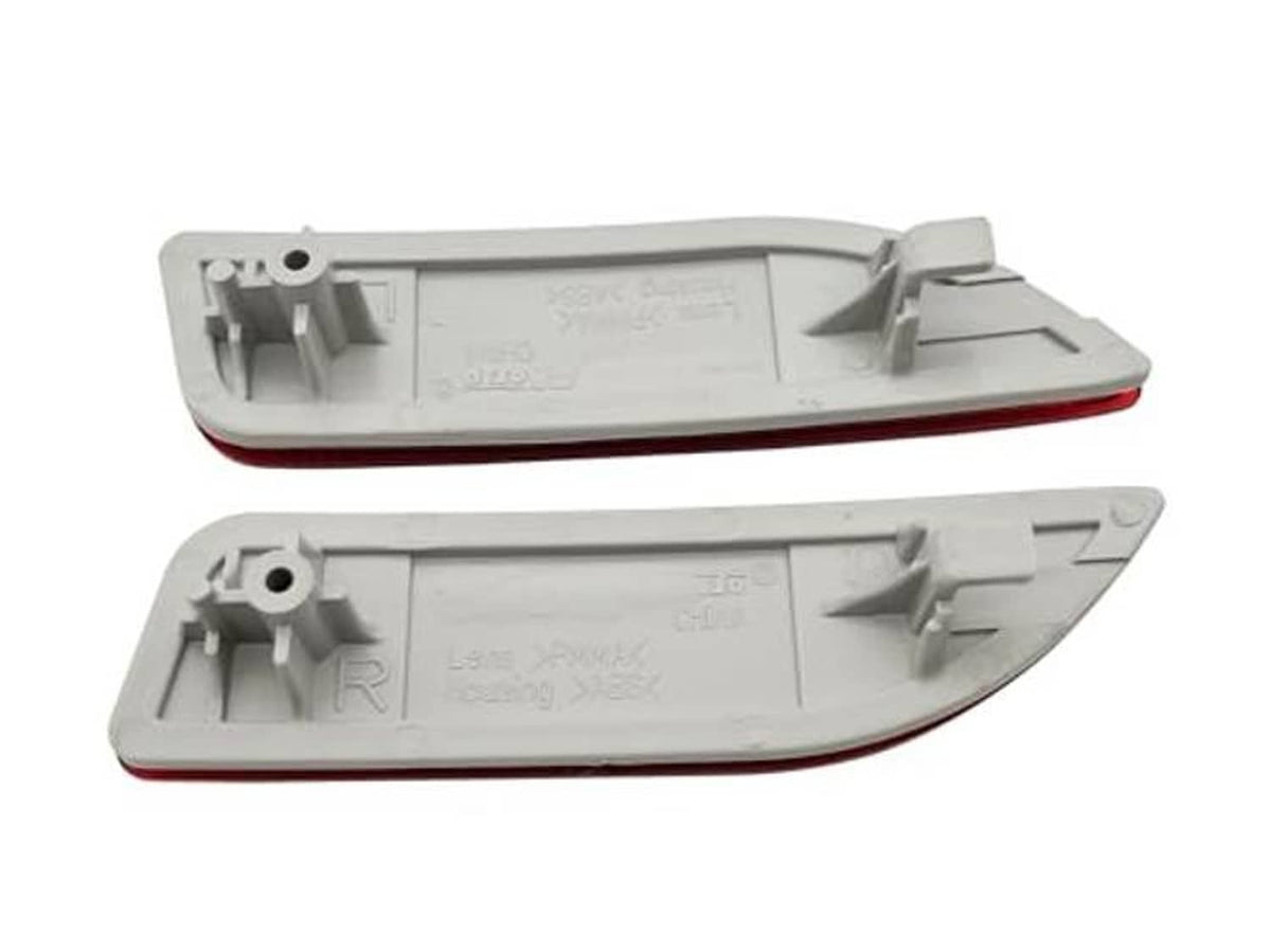 Gray plastic rear bumper reflector light housings with mounting tabs