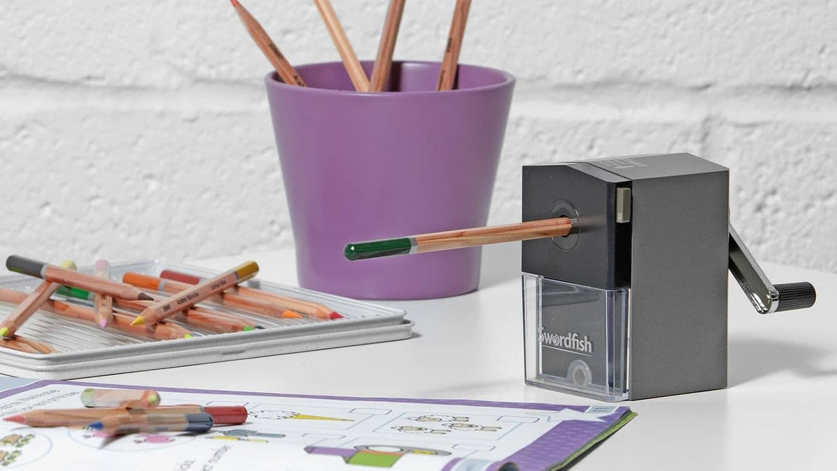Compact desktop pencil sharpener with clear shavings bin and side crank handle