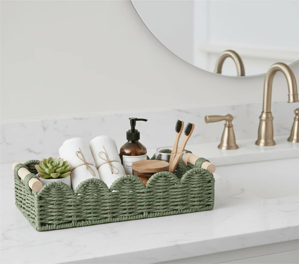 Green woven toilet paper storage basket with side loop handles on countertop
