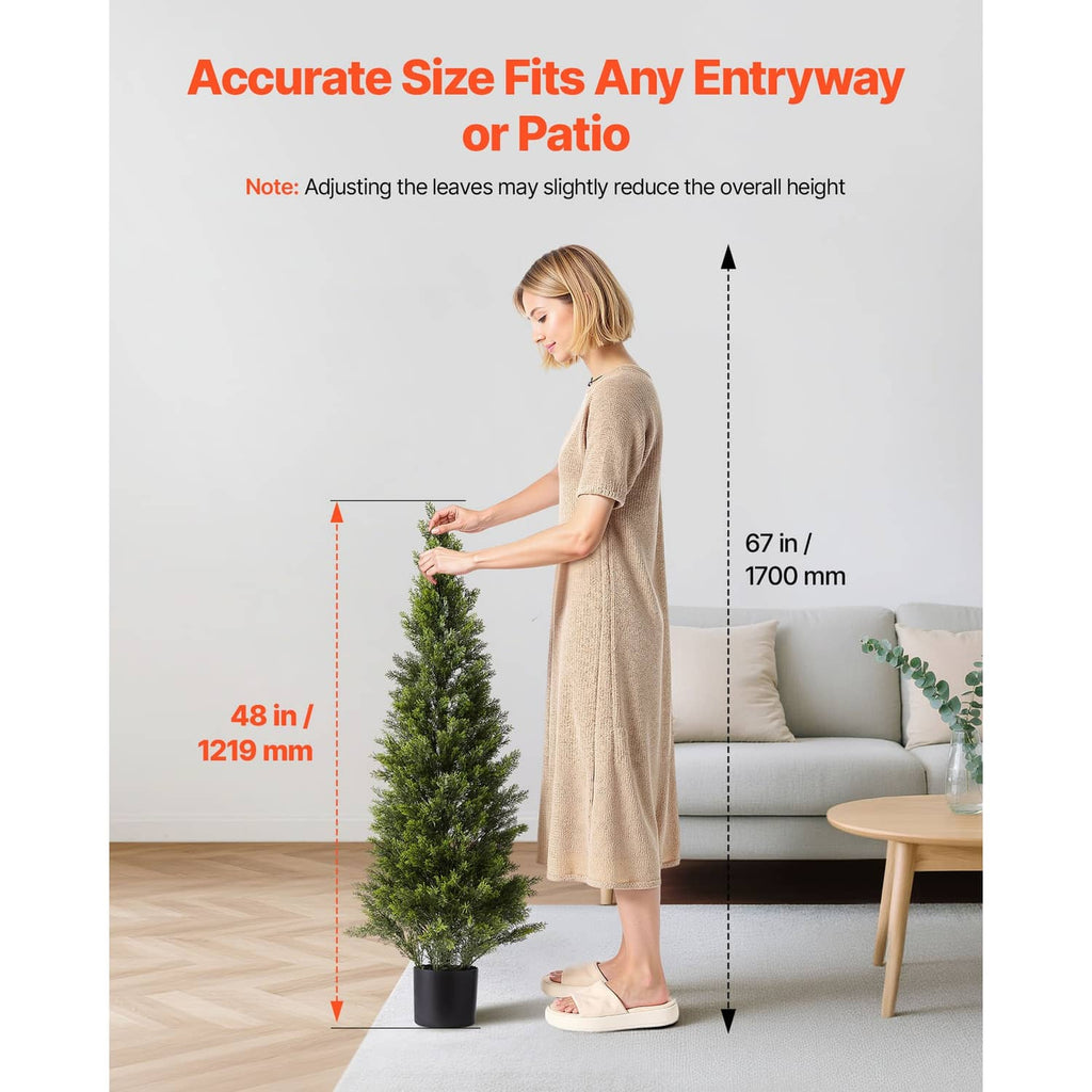 48-inch artificial cedar-style topiary tree in black planter, upright conical green foliage