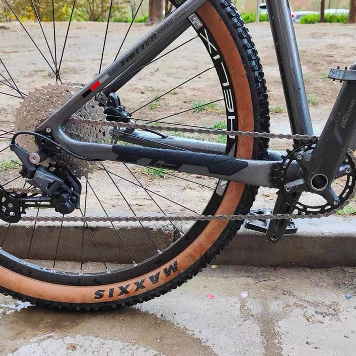 Silicone bike chainstay protector stickers on bicycle frame near rear wheel