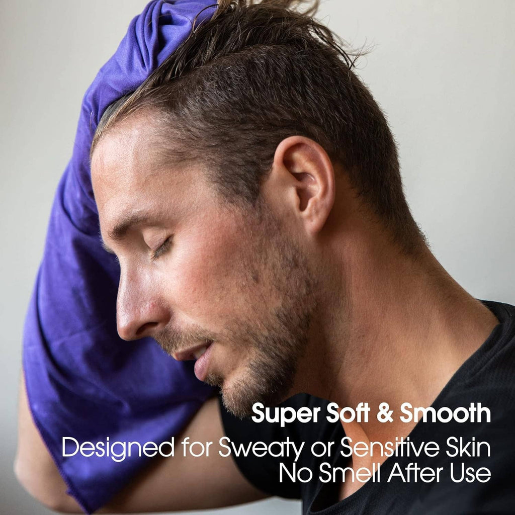 Purple microfiber towel wrapped over head, held on a person’s shoulder
