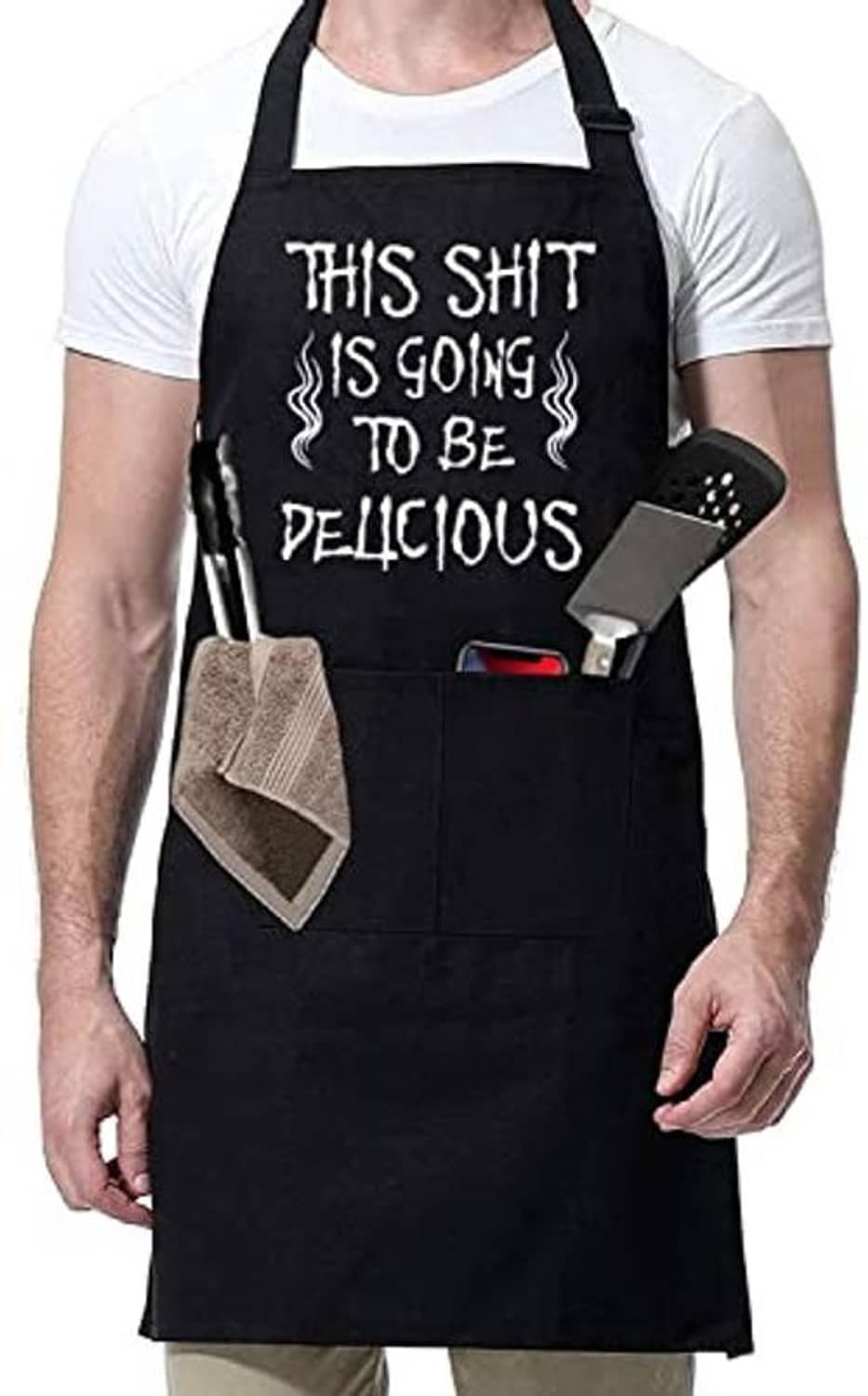 Black BBQ chef apron with funny front slogan and multiple utility pockets, worn over white shirt