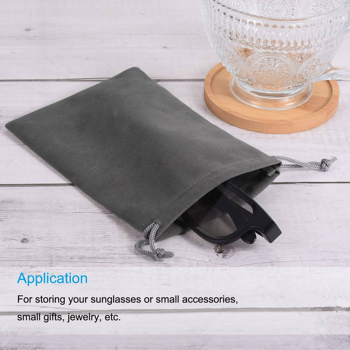 Gray microfiber drawstring pouch for small items, folded with cord ties visible