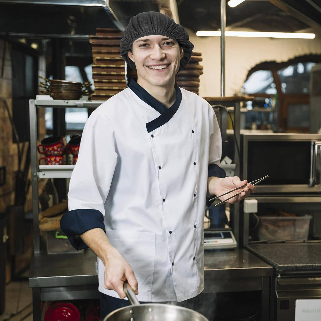 Black elastic chef hairnet cap on cook in white jacket