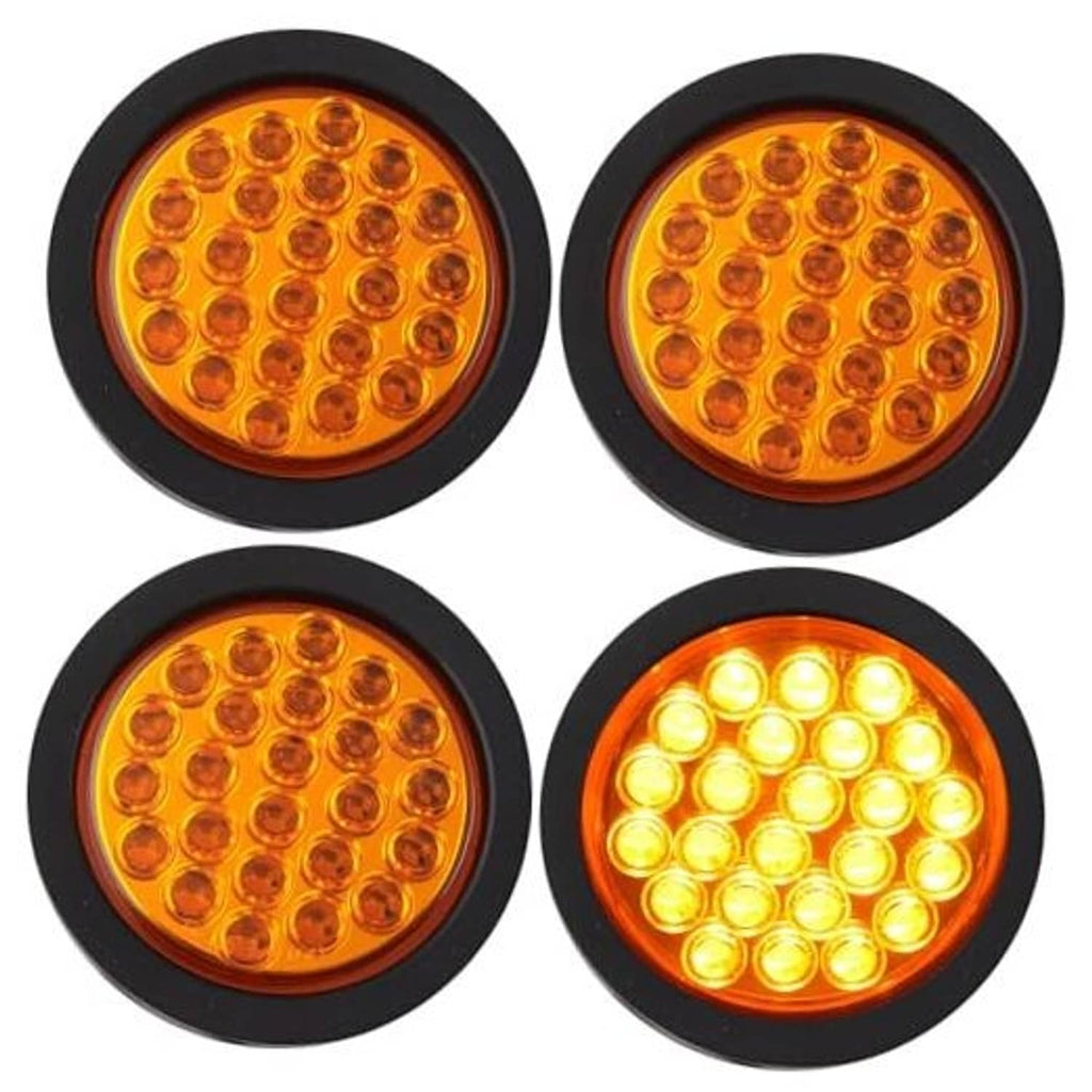 Set of four 4-inch round amber LED strobe trailer lights with black housing
