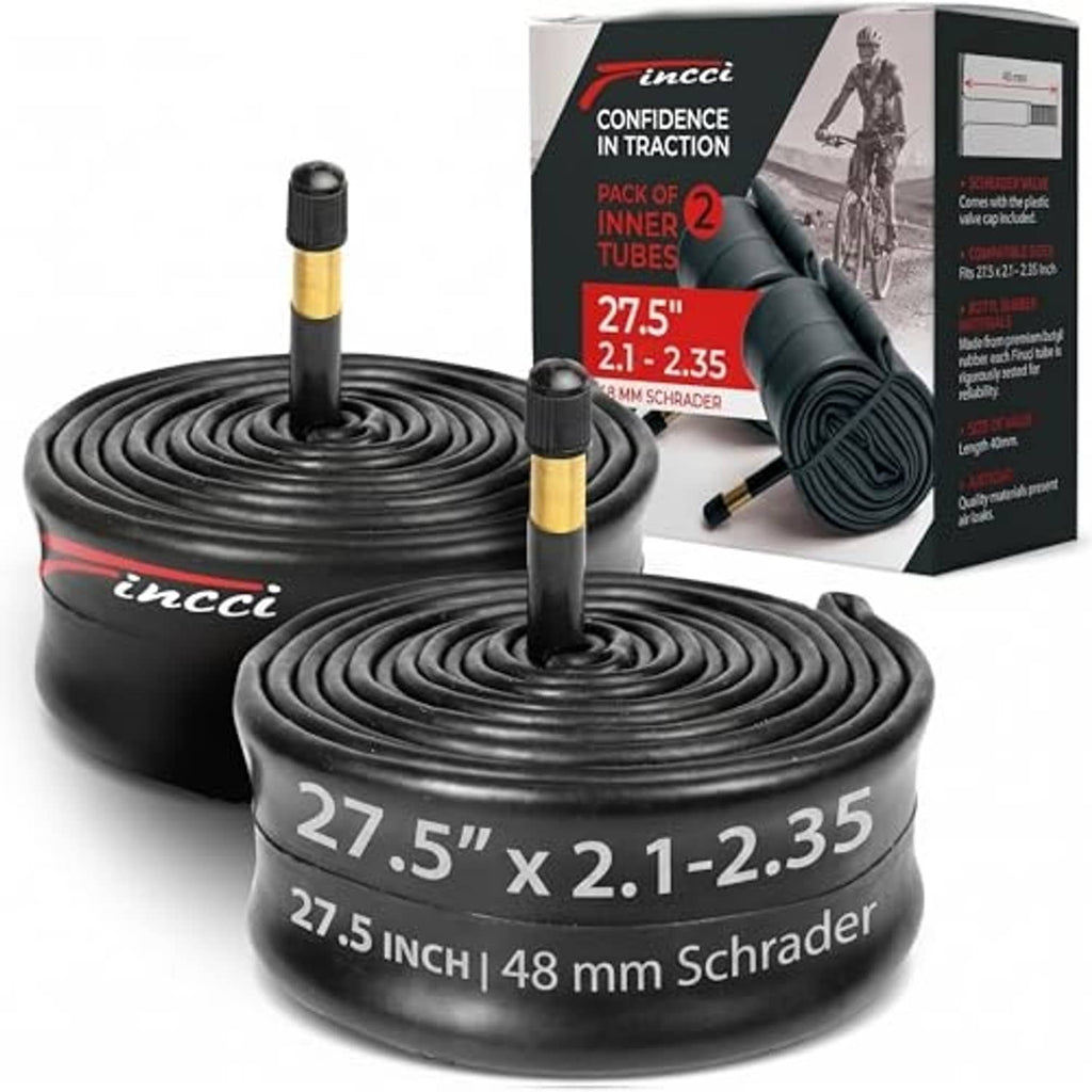 Pair of black bike inner tubes with gold Schrader valves, coiled, size 27.5 x 2.1-2.35