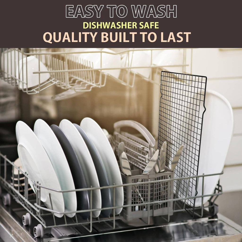 Black wire cooling rack in a dishwasher with plates and utensils.