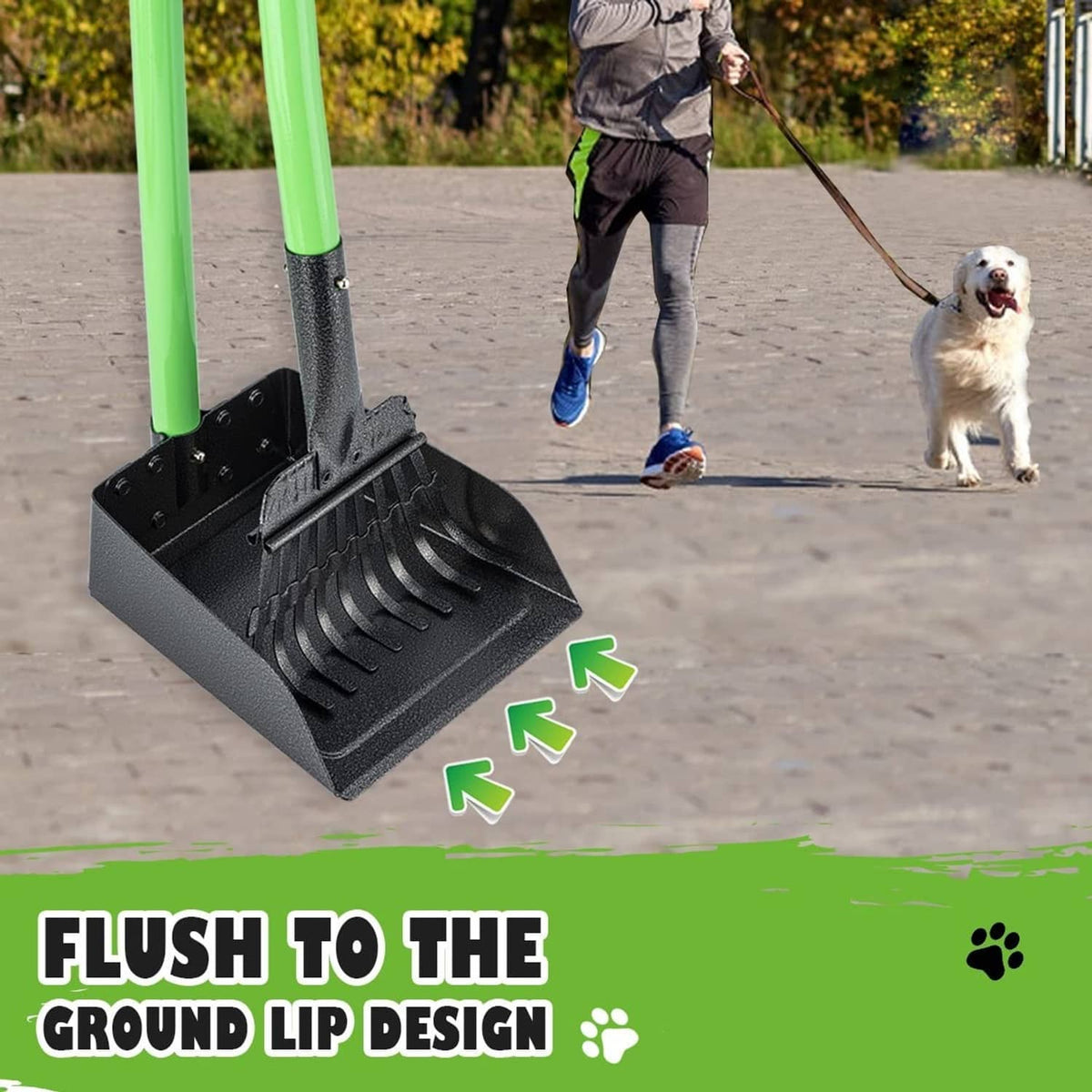 Dog pooper scooper with black rake tray and green handle on outdoor pavement