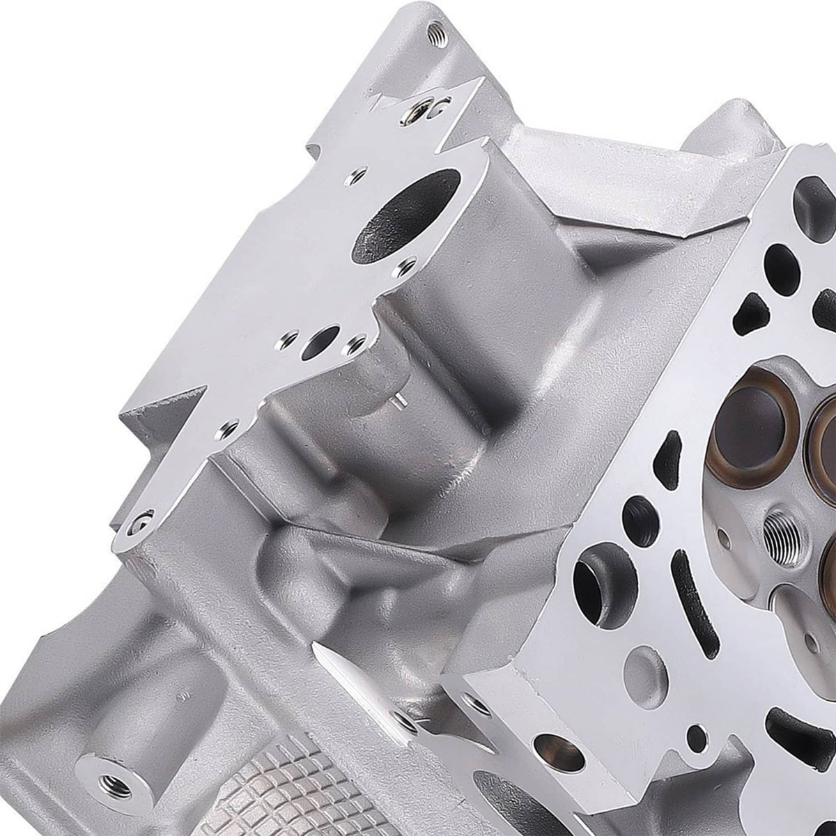 Silver gray cylinder head with bolt holes, oil passages, and intake/exhaust ports