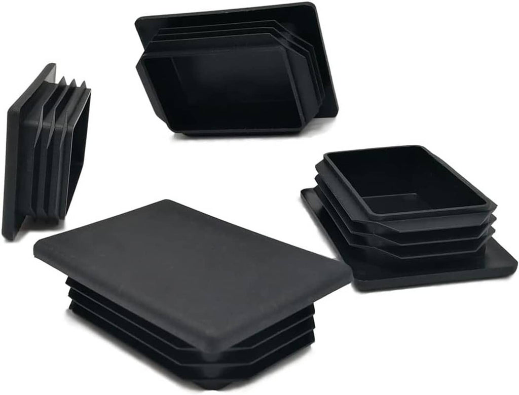 Black rectangular plastic plug insert end caps, showing stack and recessed interior