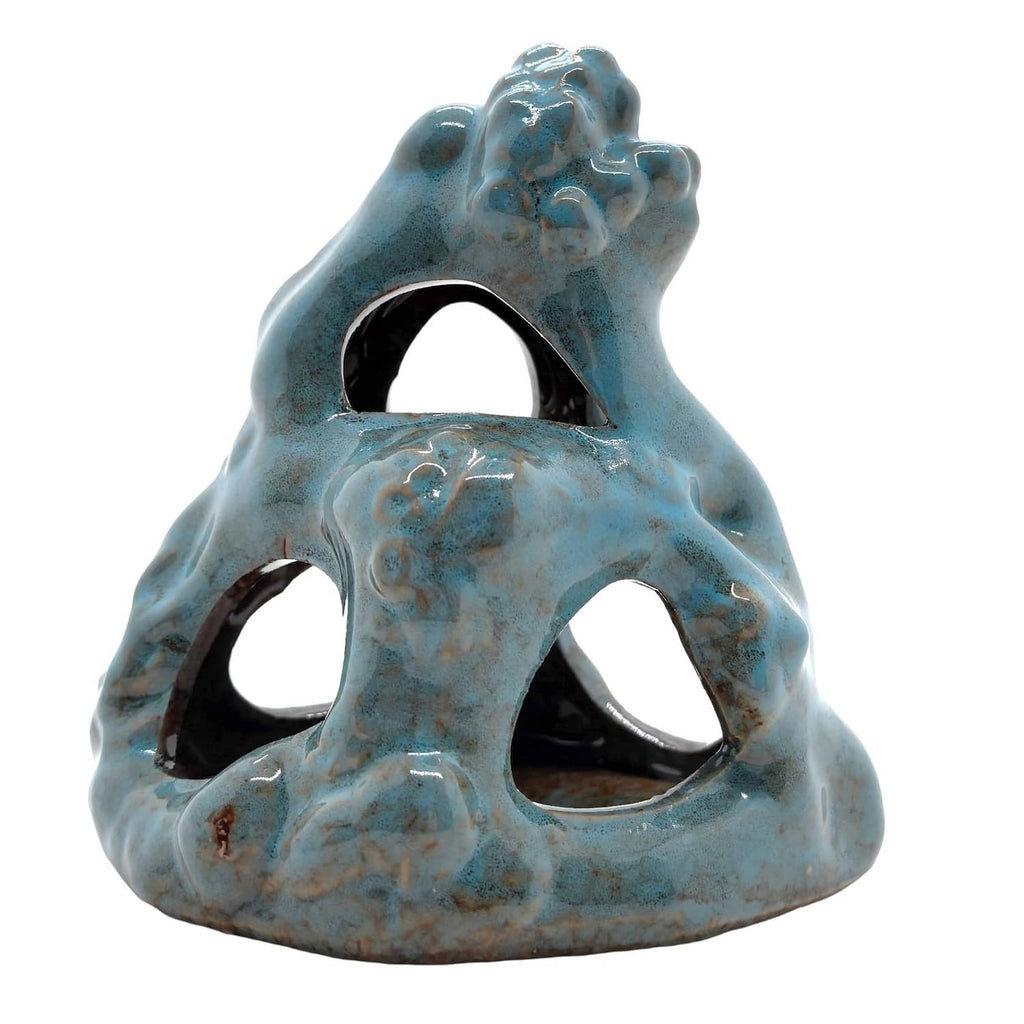 Blue ceramic cave ornament with three arches and detailed face relief