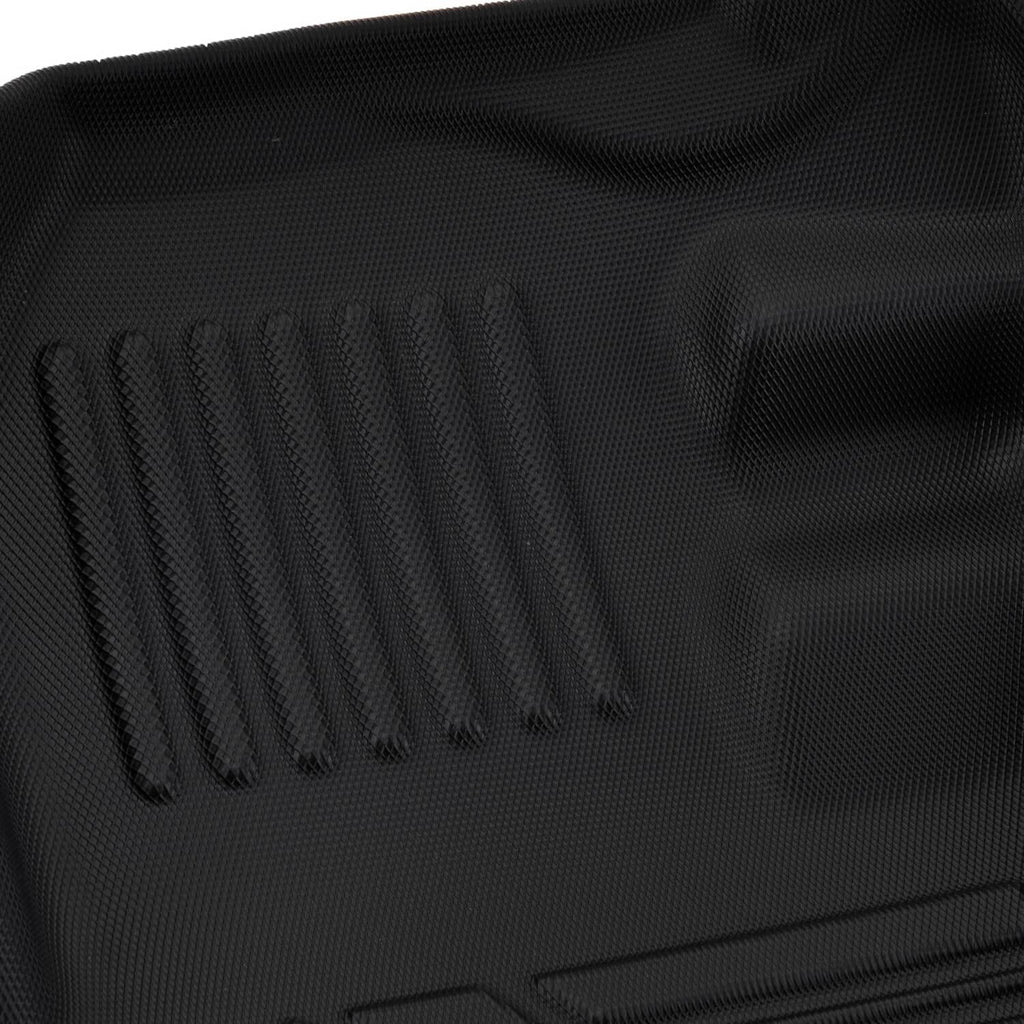 Close-up of black rubber floor mat edge with molded grip ribs and texture