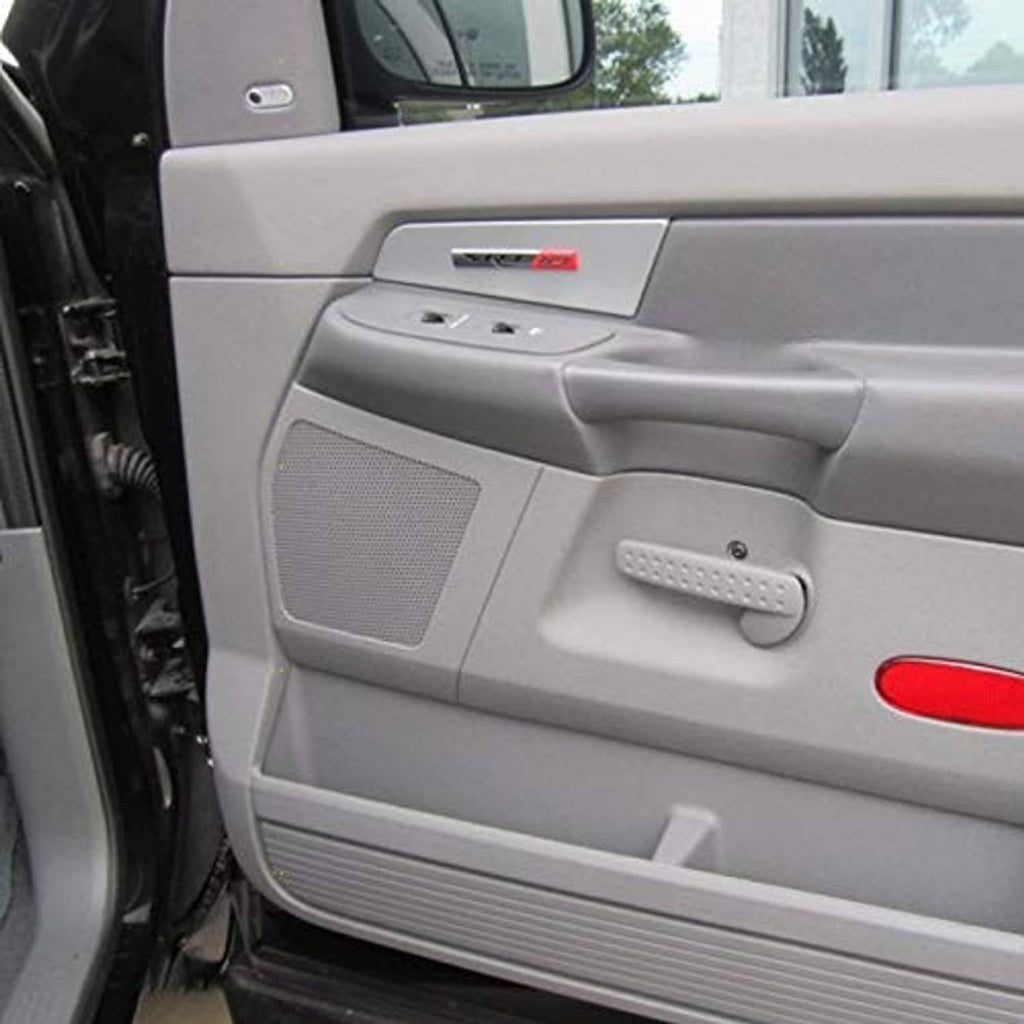 Grey interior door panel with window switch controls and handle area