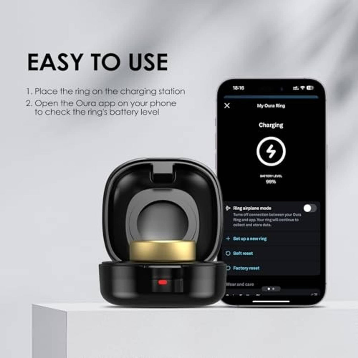 Black charging case with gold puck next to smartphone charging screen