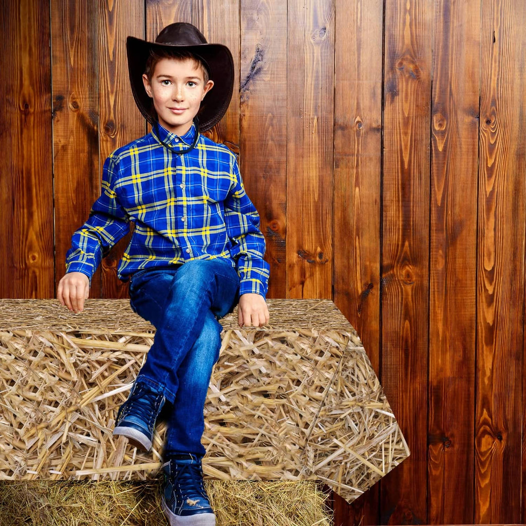 Brown straw table cover on a table top, tightly woven hay texture