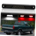 Smoked-lens LED third brake light bar with black housing, showing lit red LEDs