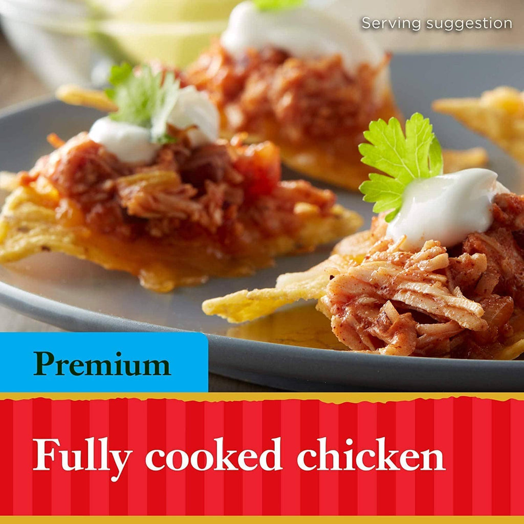 Fully cooked shredded chicken over toast with a dollop of sauce