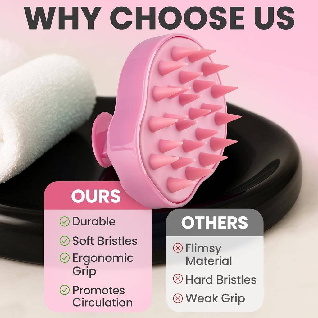 Pink scalp massager brush with soft bristles and ergonomic grip shown