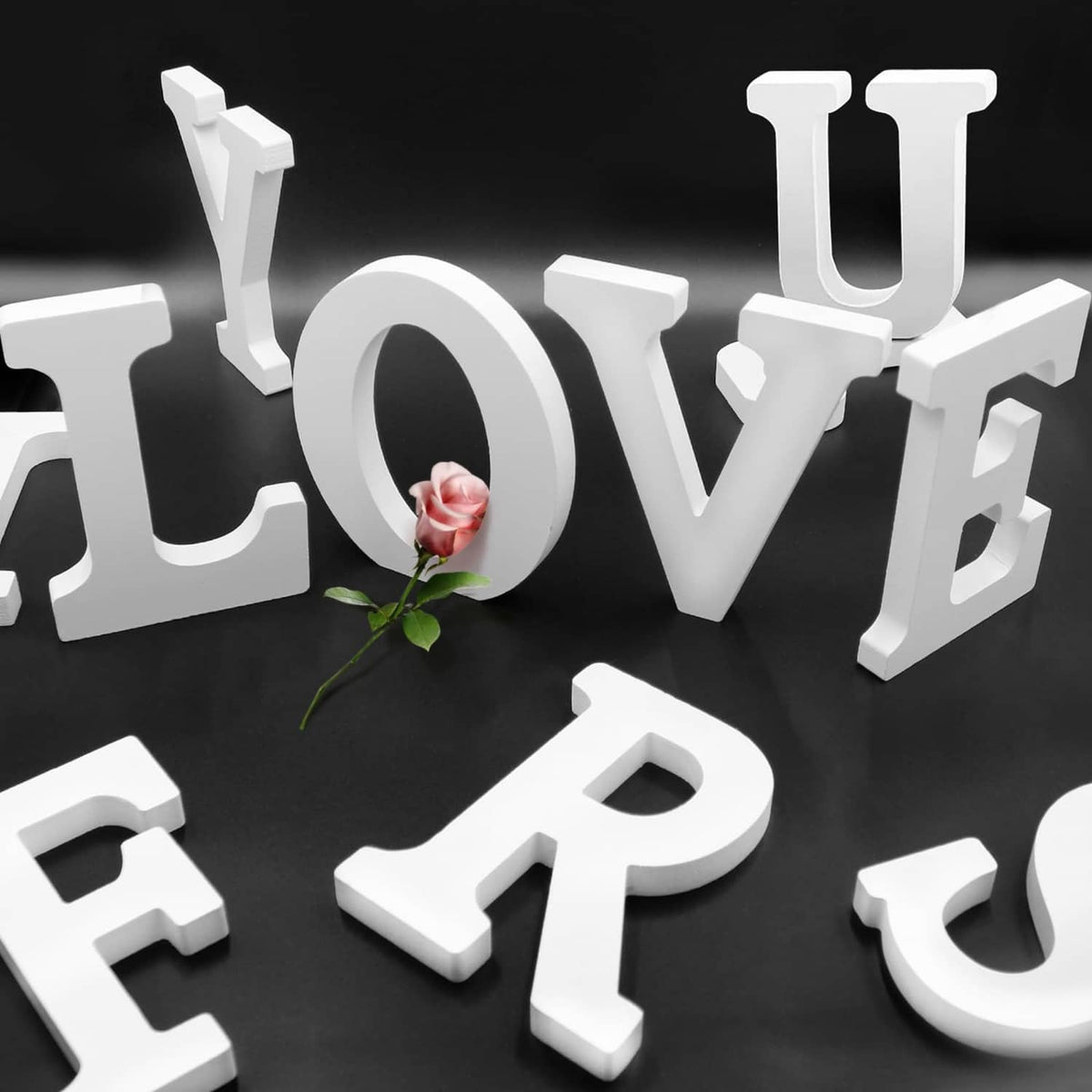 White wooden LOVE letters and PARTY word decor