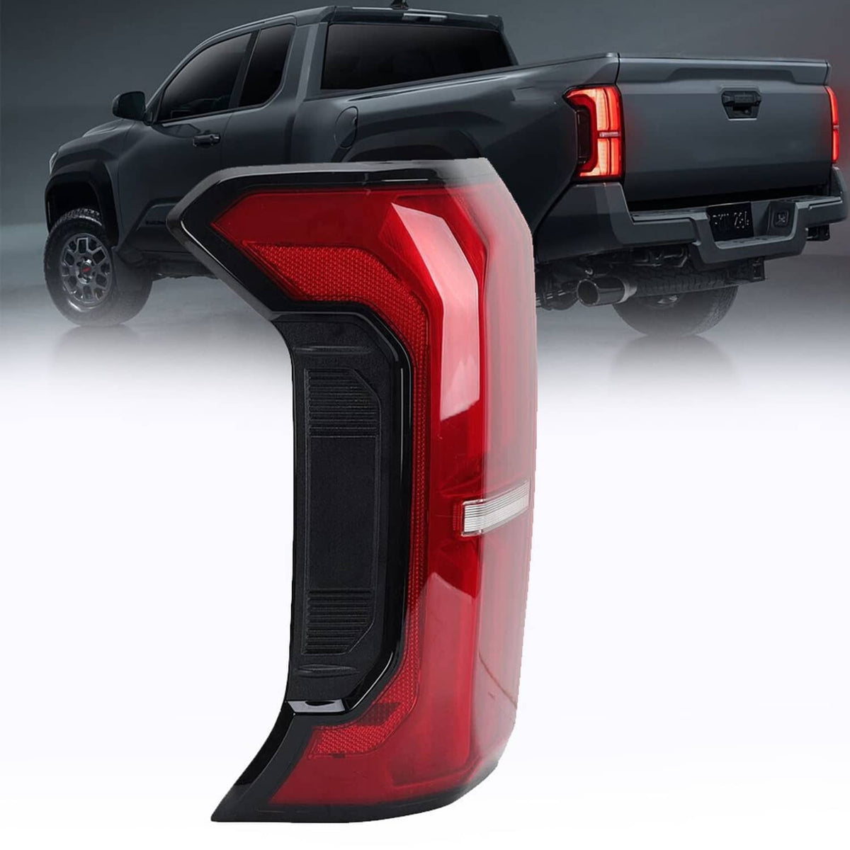 Left rear tail light assembly installed on truck, red lens with black surround and reflector