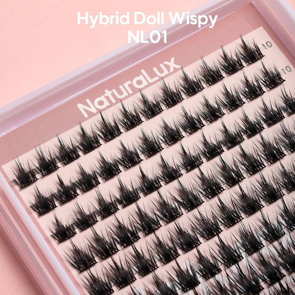 Close-up of wispy false eyelash extension strip set in a pink tray case