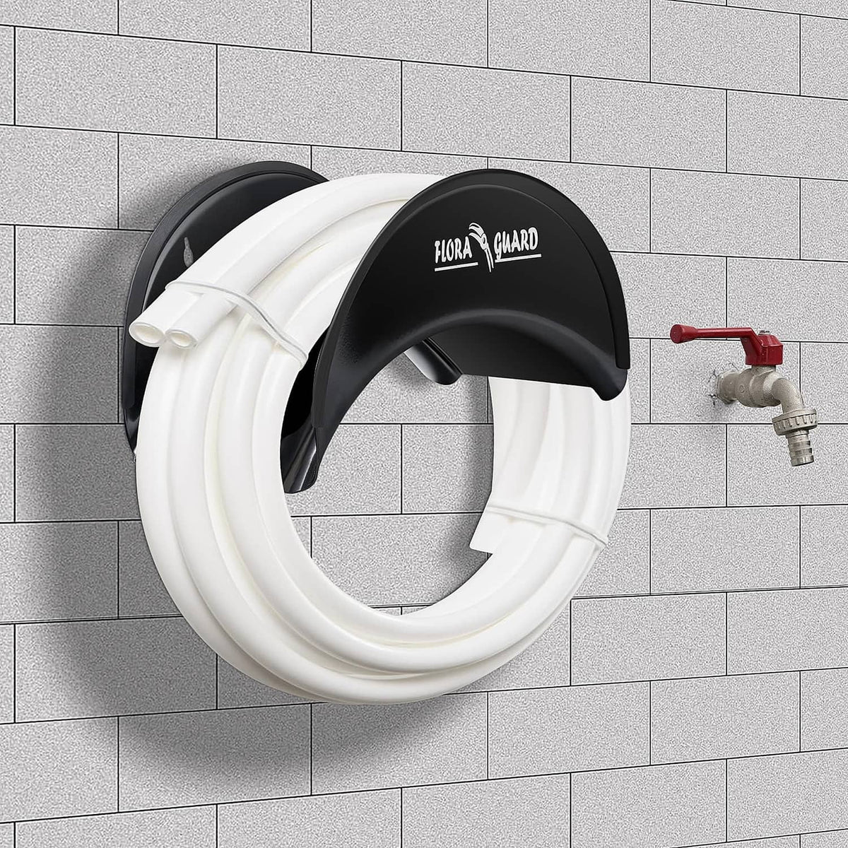 Black hose hanger holding a coiled white garden hose on a wall
