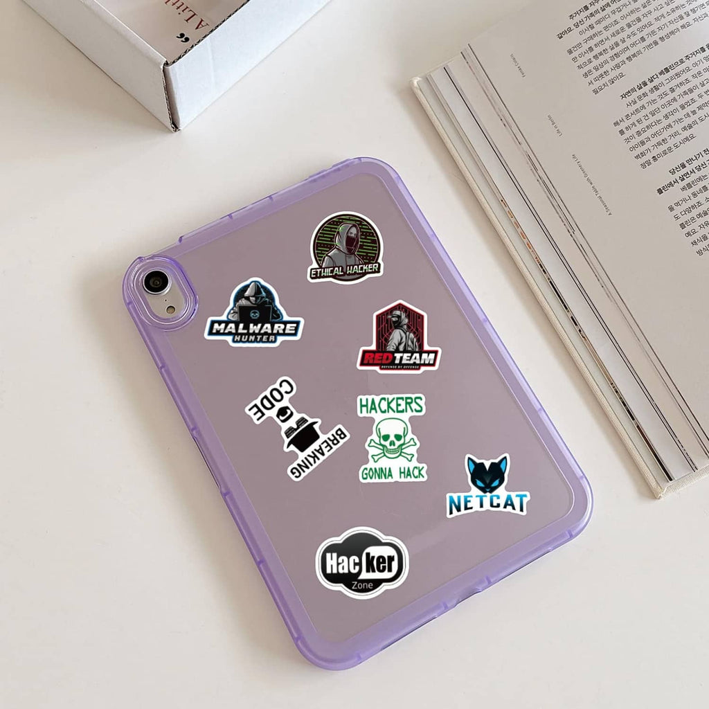 Hacker-themed stickers on a purple phone case with malware, red team, and netcat emblems