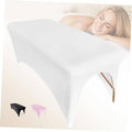 White stretchy spa bed cover with open foot section and fitted sides
