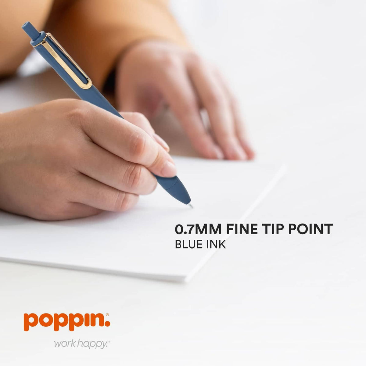 0.7mm fine tip blue ink retractable gel pen, held for smooth writing