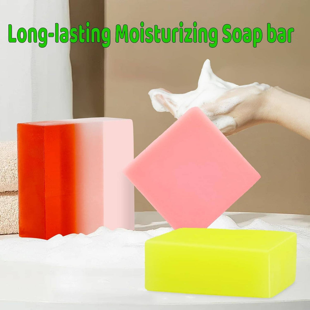 Handmade soap bars in orange, pink, and yellow with a white towel beside them
