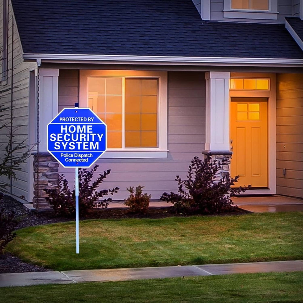 Blue octagon yard security sign on stake near front door with 'PROTECTED BY HOME SECURITY SYSTEM'
