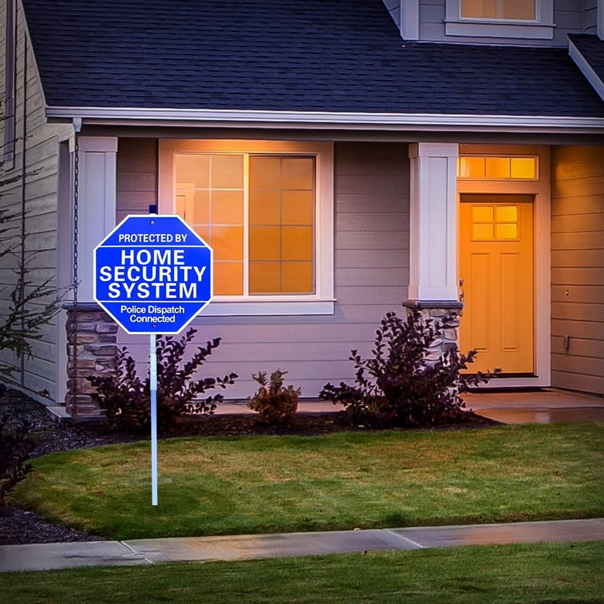 Blue octagon yard security sign on stake near front door with 'PROTECTED BY HOME SECURITY SYSTEM'