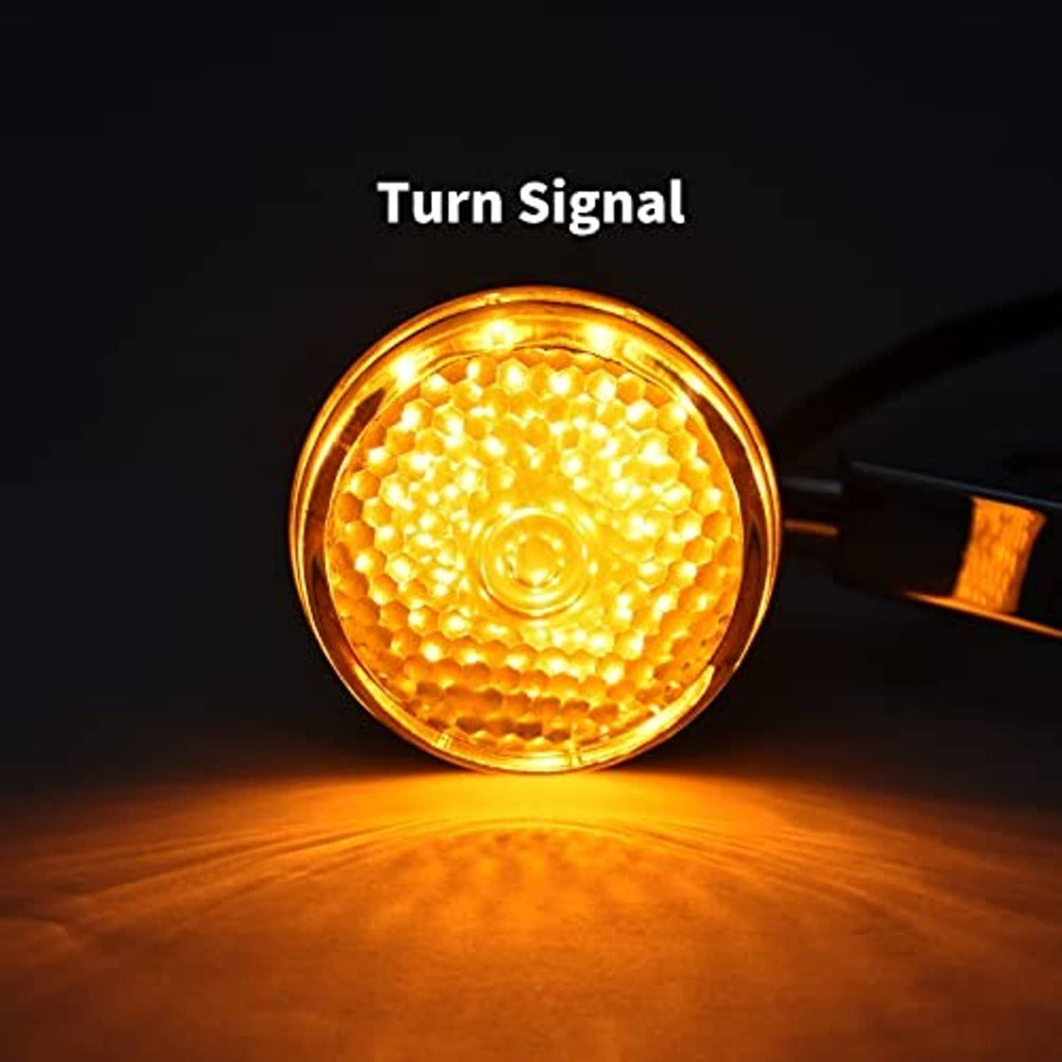 Amber glowing LED turn signal lamp with round lens and chrome rim