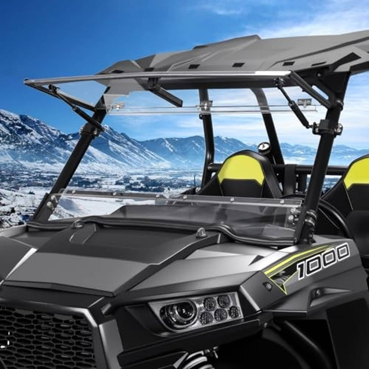 Flip-up UTV windshield installed on side-by-side with clear panel and mounting frame