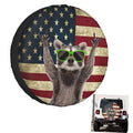 RV spare tire cover with raccoon wearing green sunglasses on American flag design