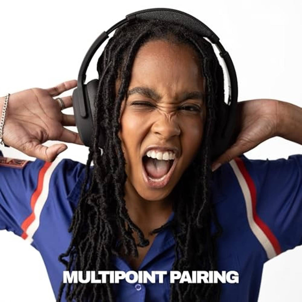 Black over-ear wireless headphones being worn on a person with long braided hair