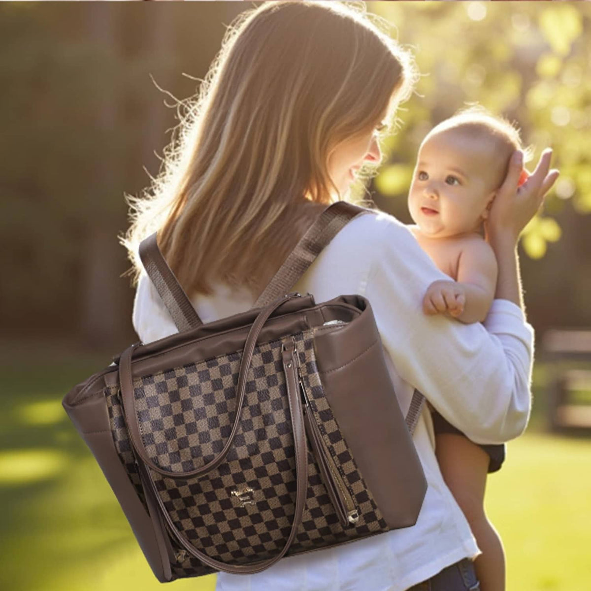 Checkered diaper bag tote with adjustable shoulder straps and brown leather-look trim