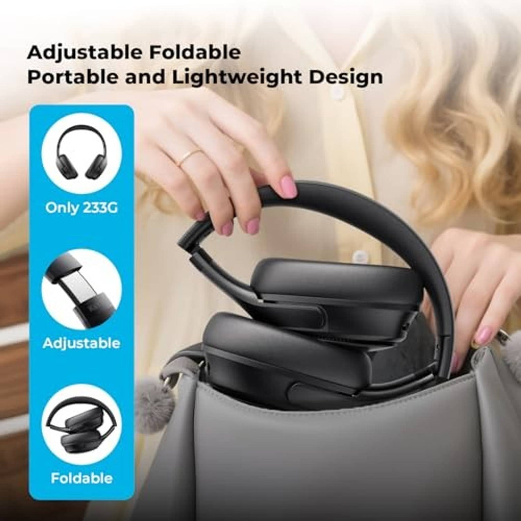 Black foldable over-ear wireless headphones with cushioned ear cups, shown open in hand