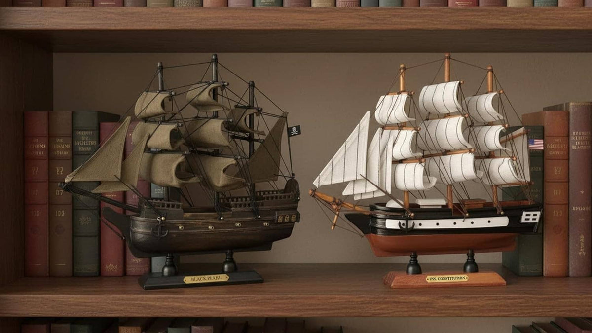 Two wooden ship models on shelf ledge, dark and white sails