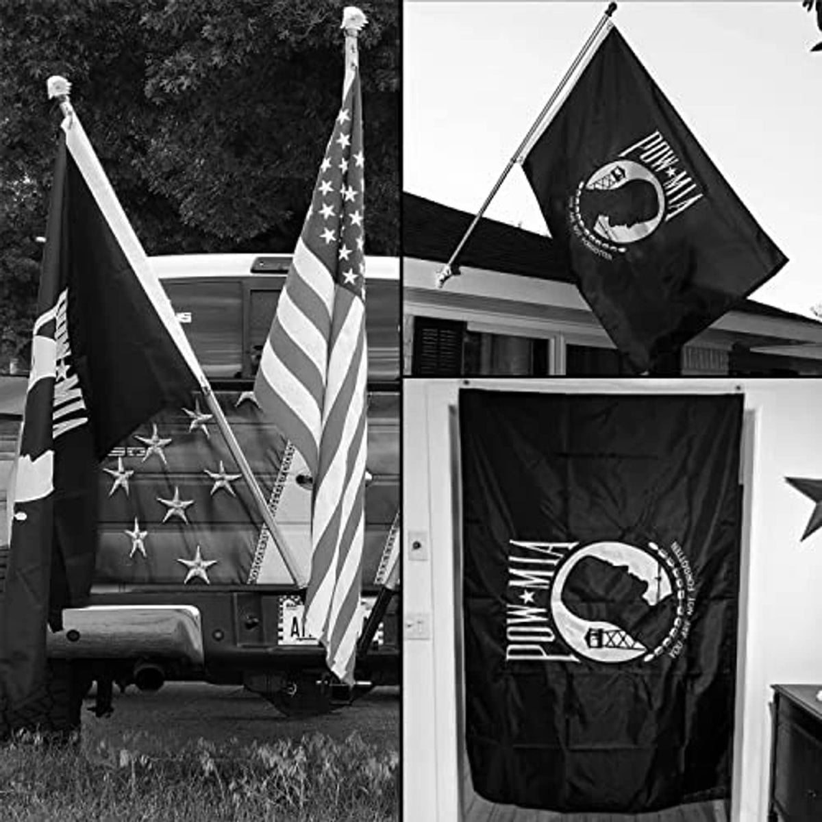 Black POW/MIA outdoor flag flying on two poles with white emblem